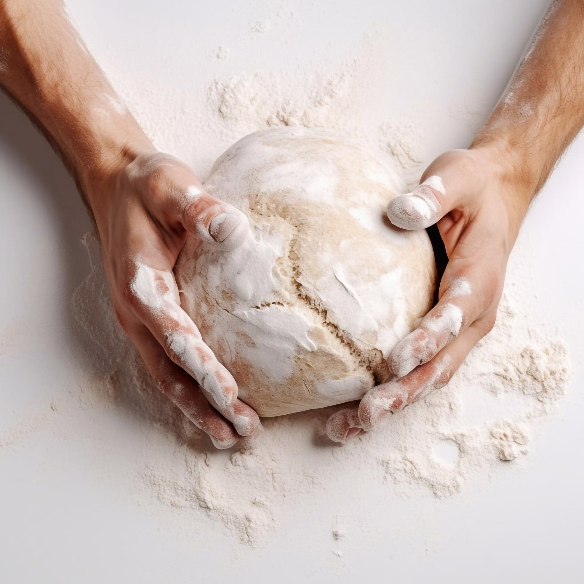Hands kneading dough